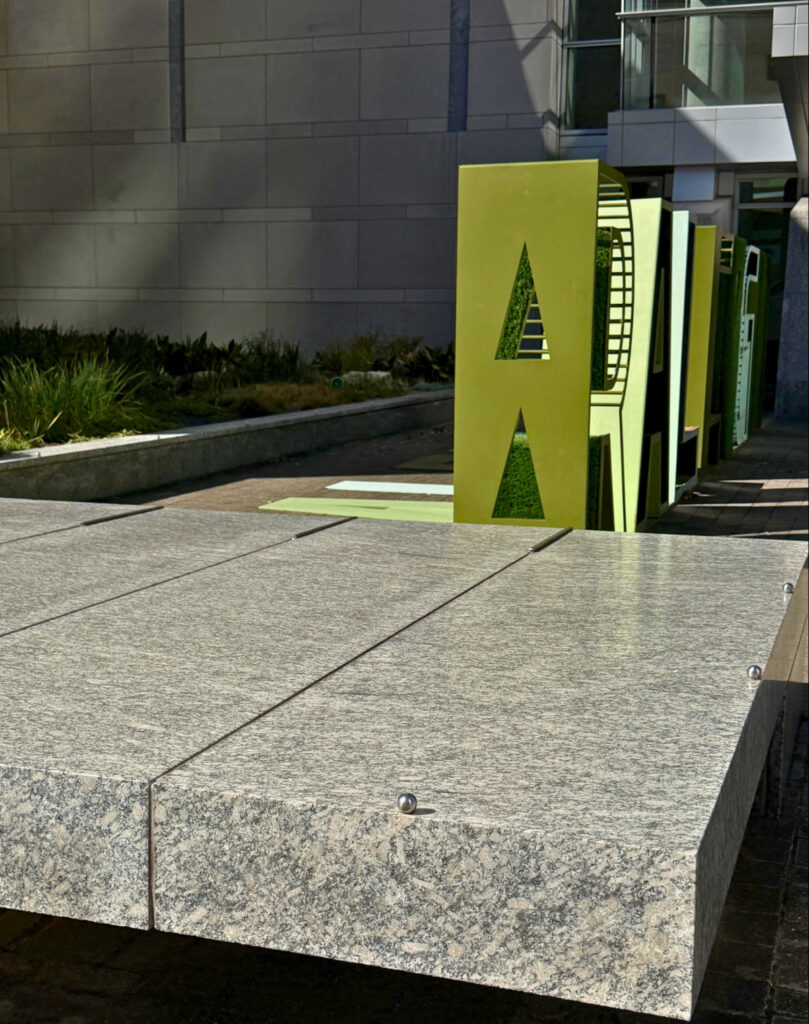 Custom cut-to-size custom granite bench using polished Greene County Granite, also known as Oconee Granite. Blackhill Granites fabricates granite products landscaping and urban hardscapes.