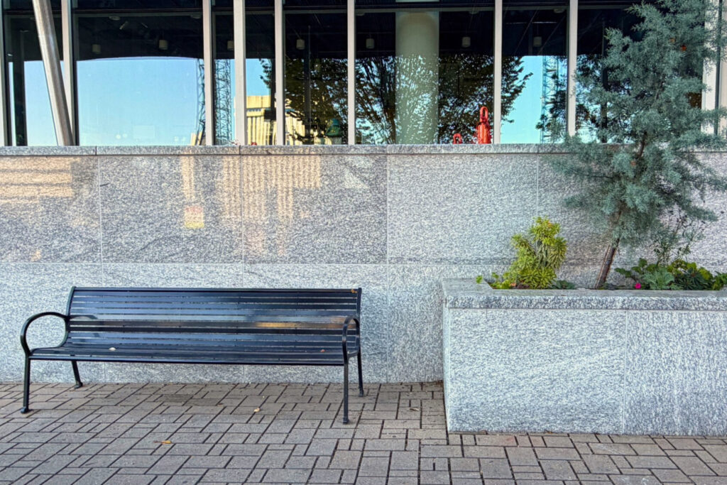 Granite retaining wall with granite coping using thermal finish Greene County Granite also known as Oconee Granite. Blackhill Granite is a trusted fabricator of custom cut-to-size dimension stone for urban hardscape and landscape use.