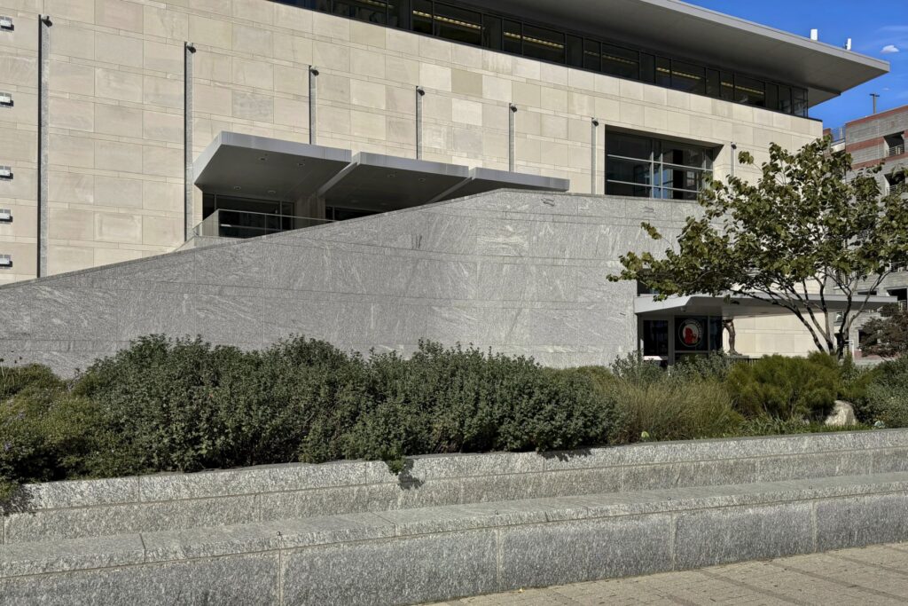 Exterior building cladding using Greene County thermal finish granite and seatwall or retaining wall using honed Greene County Granite. Blackhill Granites fabricates cut-to-size building cladding and facade elements. Greene County Granite is also known as Oconee Granite.